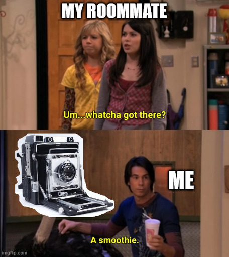 The "whatcha got there" meme, over the heads of the 2 angry people it says "My Roommate", over the other person with a smoothie it says "me", over the ostrich's face there is an attached image of a Graflex Speed Graphic 4x5 camera.
