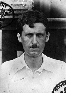 George Orwell in the British Imperial police as a young adult. He has a certain kind of mustache that combined with the stern expression on his face makes him resemble a certain very famous German Chancellor.