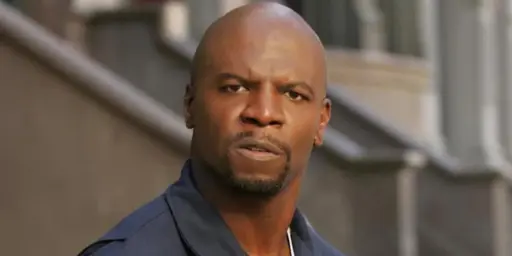 Julius, from Everybody Hates Chris, with some kind of serious expression, looking at the viewer