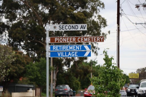 Street signs in Adelaide, Australia pointing in the same direction. One to a retirement village, the other to a cemetery. 